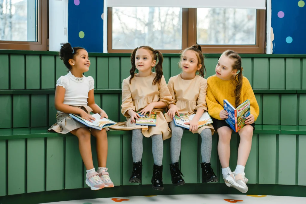 Young girls studying together in a classroom, engaged and collaborative