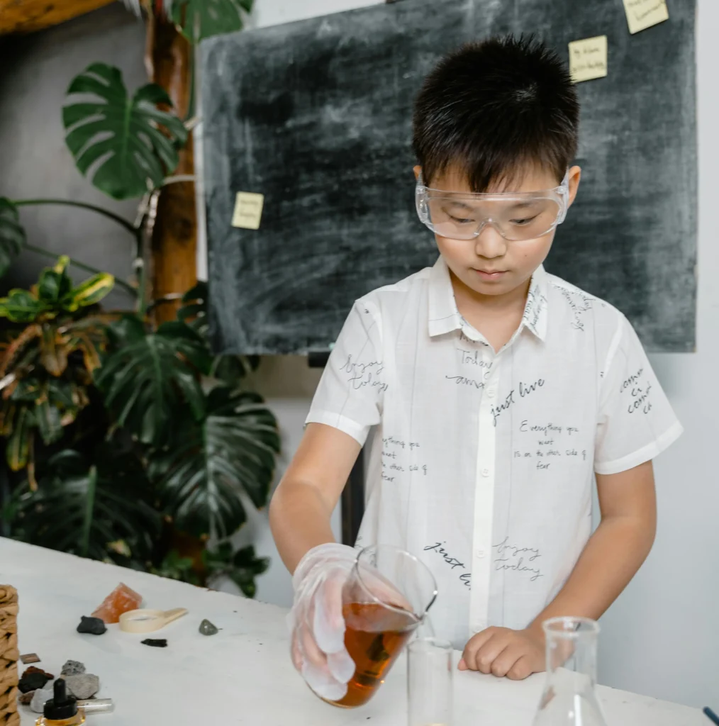 Young student doing a chemistry experiment
