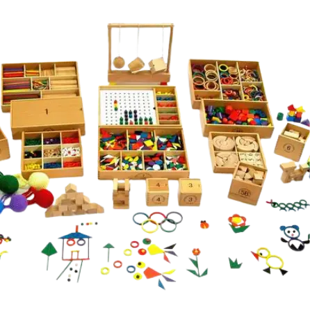 Collection of wooden educational toys and colorful geometric learning materials arranged in boxes.