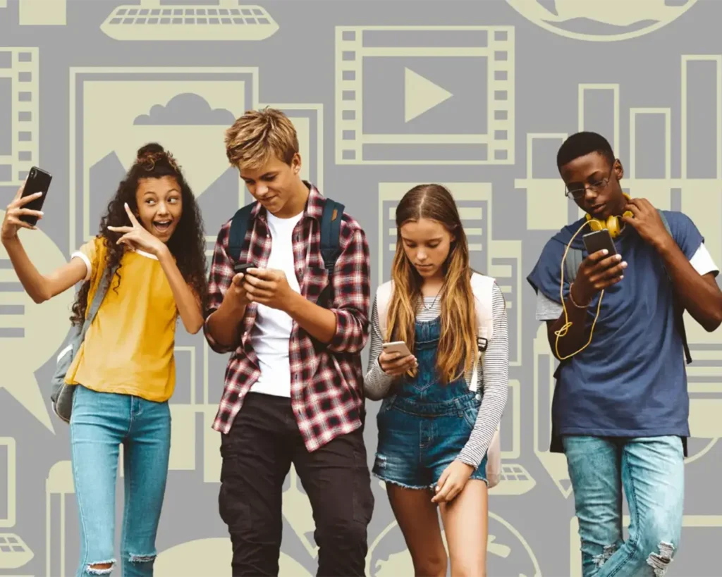 Group of four teenagers looking at their phones against a background of media icons