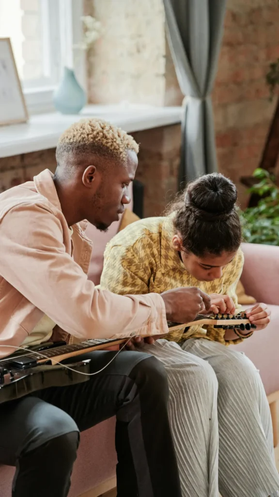 Parent supporting a child learning to play an instrument, sharing attention without pressure.